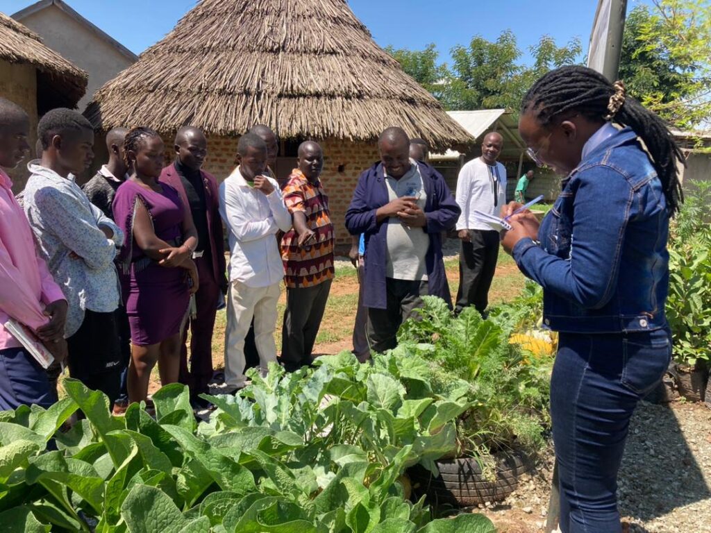 A passionate advocate and alumnus of the Nairobi Summer School on Climate Justice, Elizabeth Nandera, is proving that education and empowerment are the keys to driving change. Elizabeth is the founder of the ‘United Youth Initiative Africa’ an organization dedicated to empower the young in social, political and economic matters. Realizing that the youth are the key stakeholders of the future of African communities, we are intentional about sensitising and educating them and coming up with societal issues as we create awareness on SDGs and providing platform for young people hence reshaping the African narrative in the face of the world. With 315 active youth members, 102 are female, 213 male and 3 people with disabilities. Each member of the organisation is affiliated to a business club carrying out Agricultural activities. Her journey from Nairobi Summer School to a climate change leader is a testament to the programs’ profound impact. “In Nairobi, I gained invaluable insights into the complexities of climate justice and learned from leading experts in the field. This experience has not only shaped my understanding of climate issues but has also given me focus to lead my organization towards a more sustainable and impactful future,” said Elizabeth during an interview. The United Youth Initiative Africa seeks to consistently promote and inspire sustainable outcomes that will empower young people to lead Africa toward a sustainable future. This vision, deeply rooted in climate justice principles, reflects her commitment to reshaping the narrative surrounding climate change in Africa. The mission of the United Youth Initiative Africa, as articulated by Elizabeth, is to create pathways for empowering young people and underprivileged communities to develop sustainable outputs. To achieve this mission, the organization employs a multifaceted approach: Capacity Building and Training: Empowerment starts with knowledge. The organization provides training and capacity-building programs to equip young people with the skills and expertise needed to address climate change effectively. The organisation hosted the third leading agriculturalist in Uganda, Dr Dauson Musasizi, owner of Busoga Farmers Resource Centre on 27th July 2023 who engaged the community in a study about smart sustainable Agriculture and green jobs. This session was attended by 518 people coming from different villages around Busia District. The organisation carried out another Capacity building session recently on 13th September where 17 people visited Busoga Farmers Resource Centre and had a hands on study on smart sustainable agriculture and green jobs. All knowledge acquired is to help the community adapt to the threat of climate change. Advocacy: To drive policy change and raise awareness, the United Youth Initiative Africa engages in advocacy efforts at the local, national, and international levels. Elizabeth and her team work tirelessly to ensure that the voices of Africa’s’ youth are heard on the global stage. Nandera Elizabeth effectively represented United Youth Initiative Africa during the African Climate Summit. Collaboration and Environmental Conservation: Collaboration is at the heart of Elizabeths’ approach. Her organization partners with like-minded groups, NGOs, and governmental agencies to amplify their impact. UYIA collaborates with other youth groups like Kobujoi Community Forest Association and Baraga youth from Kenya. Environmental conservation is a key focus, with the organization actively involved in projects that promote sustainable practices like recycling plastics and planting vegetables in sacks. Elizabeth Nandera credits the Nairobi Summer School on Climate Justice impact as a turning point in her journey. During her testimonial speech, she shared how the program equipped her with the knowledge and skills necessary to steer her organization in the right direction. She emphasized that the experience provided her with a renewed focus on addressing climate change effectively. Elizabeth Nandera’s story is a testimony to the power of education, empowerment, and commitment in the fight against climate change. Through the Nairobi Summer School on Climate Justice, she found the inspiration and resources needed to lead her organization, the United Youth Initiative Africa, toward a brighter and more sustainable future for Africa and the world. Her journey serves as a beacon of hope for young leaders striving to make a difference in the face of the climate crisis.